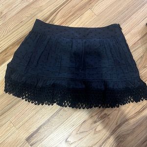 Juicy couture women size 2 black mini skirt with lace 70% cotton, 30% silk.